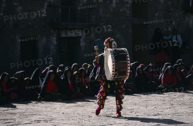 PERU, Music, Masked Taquile drummer performing for Yuyachkani folkloric group.