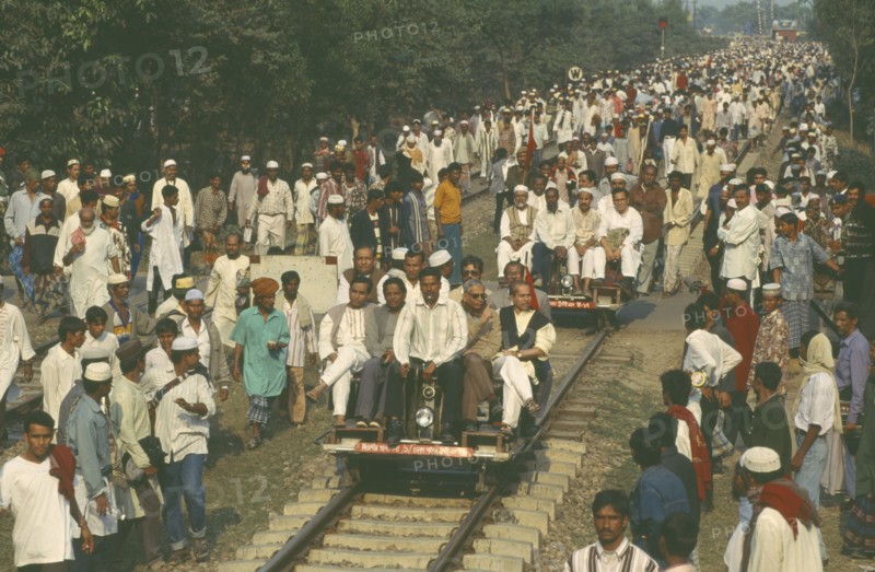 BANGLADESH, Dhaka, Railway inspectors checking and clearing track before train due to huge crowds returning from muslim festival.
