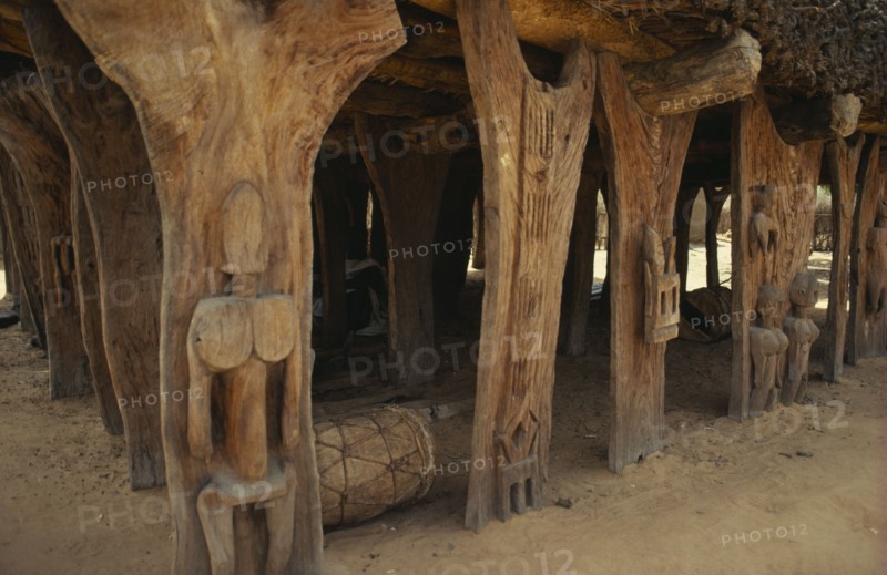 MALI, Architecture, "Detail of Dogon Togu na or case a palabres, open sided meeting place of the village elders with thatched roof of millet stalks supported by carved wooden posts. "
