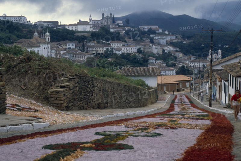 BRAZIL, Religion, Easter, Easter Day parade route leading down hill towards town carpeted with flowers.
