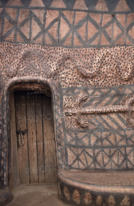 GHANA, North, Architecture, "Detail of traditional mud architecture painted with red and black abstract geometric design and crocodile, the totem symbol of saving the life of a clan member."