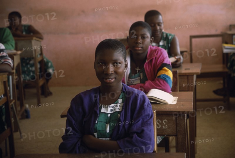 GHANA, North, Jirapa, "Students at St Francis girls secondary school, seated at desks in classroom."