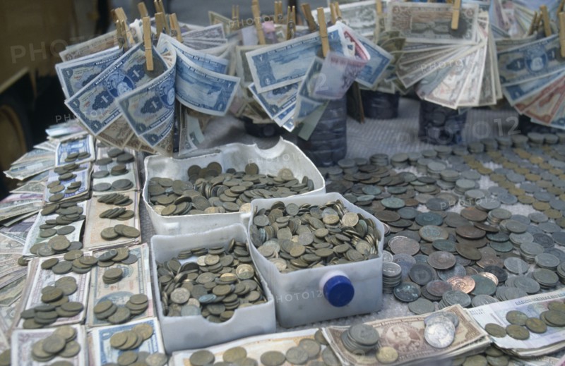BRAZIL, Market, Stall with many different types of Brazilian coins and notes which have changed frequently.