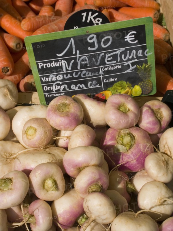 FRANCE, Deux Sevres Region, Poitiers, Turnips and carrots on sale at the market in the town of Rouille.
