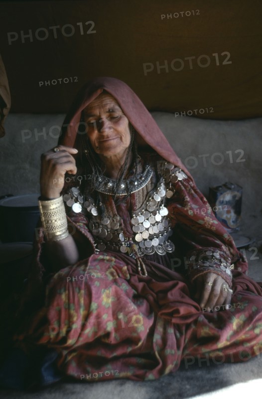 AFGHANISTAN, Paktia Province, Portrait of woman of the Jajia tribe wearing traditional dress and jewellery.