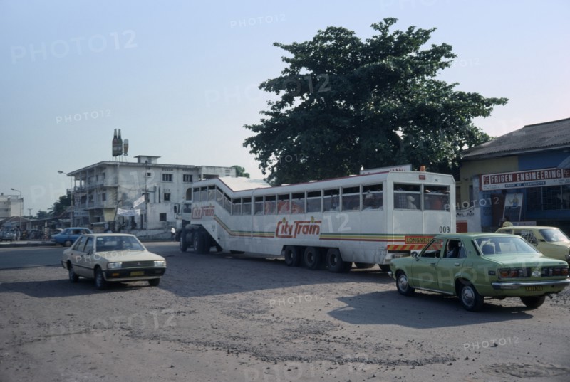 CONGO, Kinshasa, Street scene with bus and other traffic.