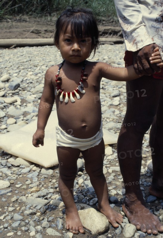 PANAMA, Candelaria, Choco Indian girl wearing monkey tooth necklace.
