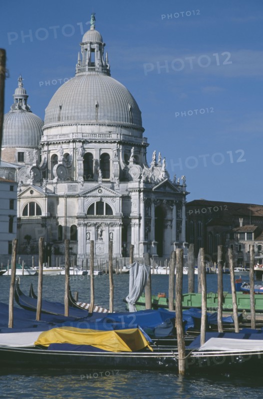 ITALY, Venice, Grand Canal. Church of Santa Maria Della Salute seen from across water and empty Gondola boats