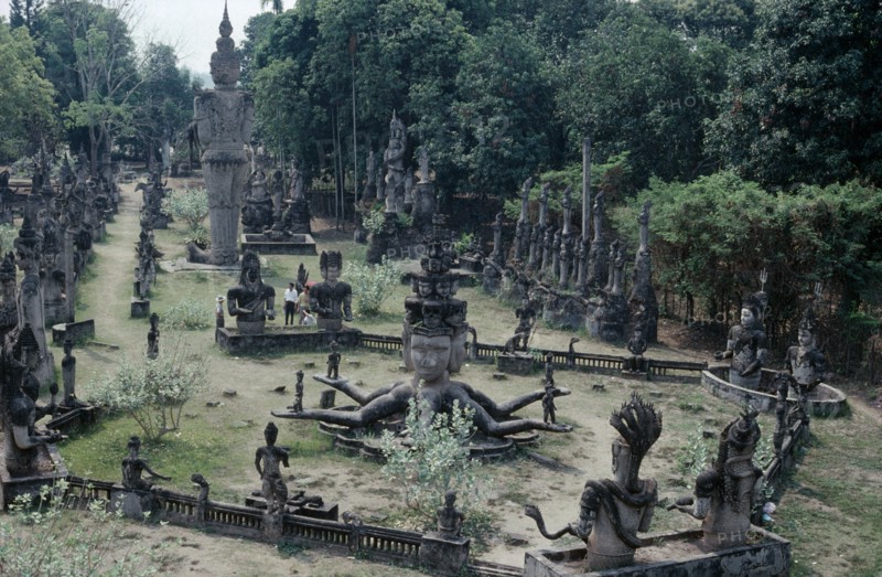 THAILAND, Nong Khai, Wat Khaek, Buddha park. Collection of religious statues in a garden