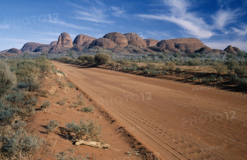 AUSTRALIA, Northern Territory, Uluru National Park, "A dirt road through the park, with Katatjuta, The Olgas, in the background."