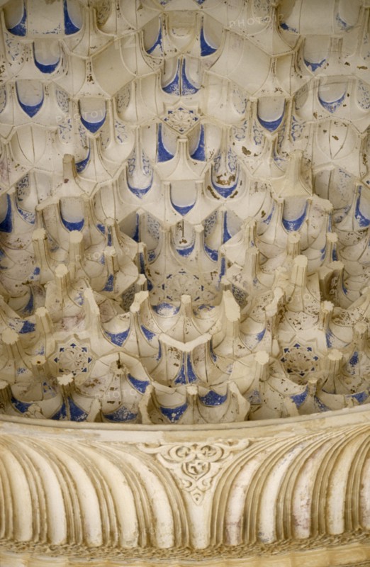 SPAIN, Andalucia, Granada, The Alhambra.  Detail of intricate stonework in the Ambassador’s Room.