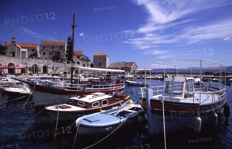 CROATIA, Dalamatia, Brac, "Bol, boats in marina. The marina in the small village isolated on the islands southern coast is filled with fishing boats aswell as schooners and yachts "