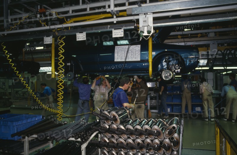 GERMANY, Sachsen, Workers on factory floor of Volkswagen production plant.