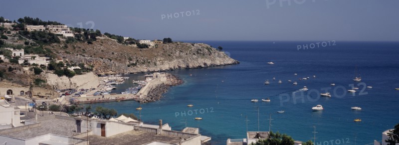 ITALY, Puglia, The village of Castro Marina on the South Adriatic Sea coast. Boats at sea and in the harbour.