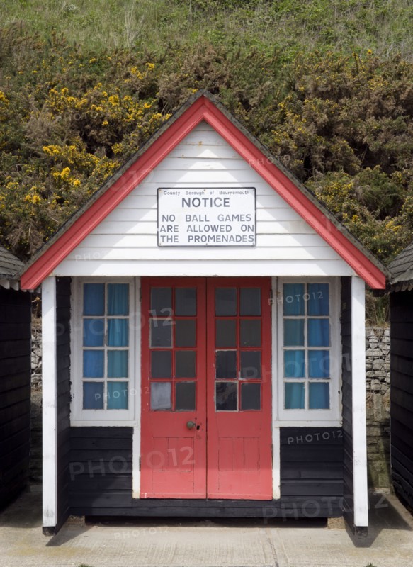 ENGLAND, Dorset, Bournemouth, Beach hut on The East Beach with a sign saying that no ball games are to be playe