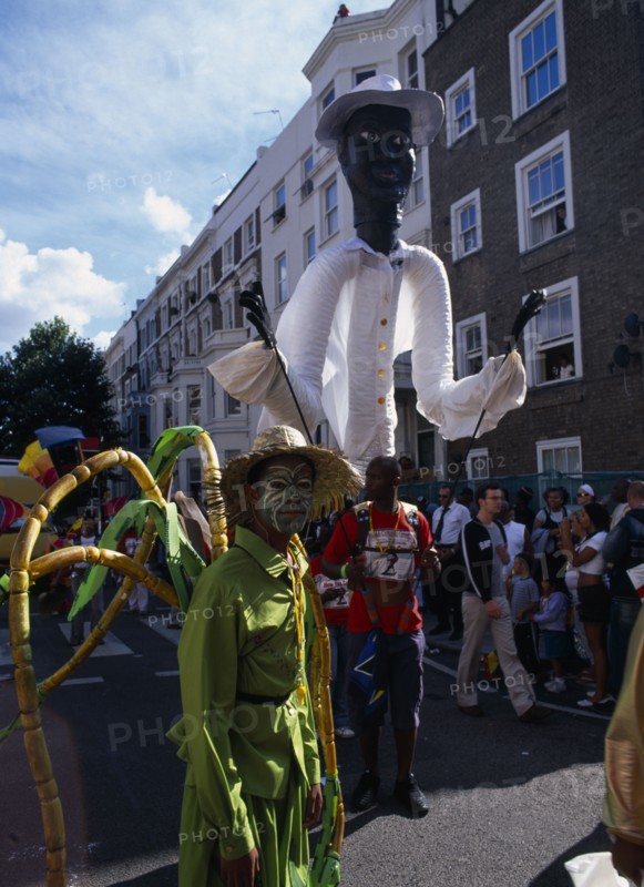 ENGLAND, London, Notting Hill carnival reveller in extravagant costume.