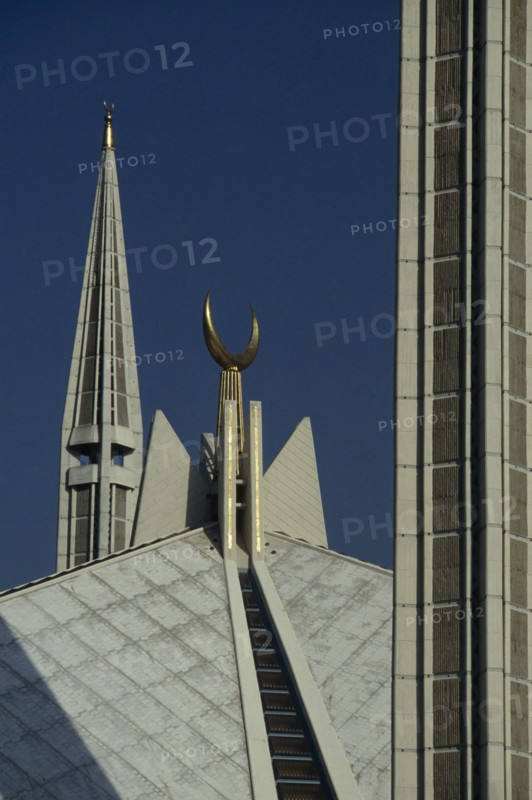 PAKISTAN, Islamabad, "Detail of the Shah Faisal mosque, white rooftop, minarets and crescent moon symbol of Islamic faith.  Design by Vedat Dalokay, construction completed 1986."