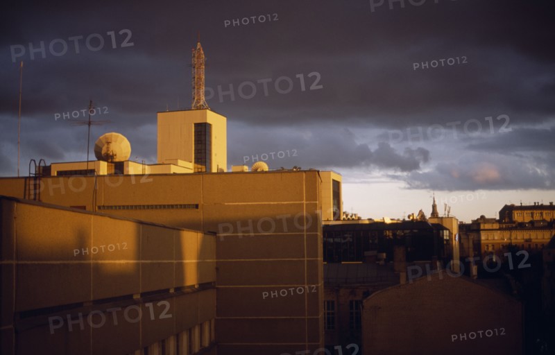 RUSSIA, Moscow, City view of roof tops at sunset with a stormy sky.