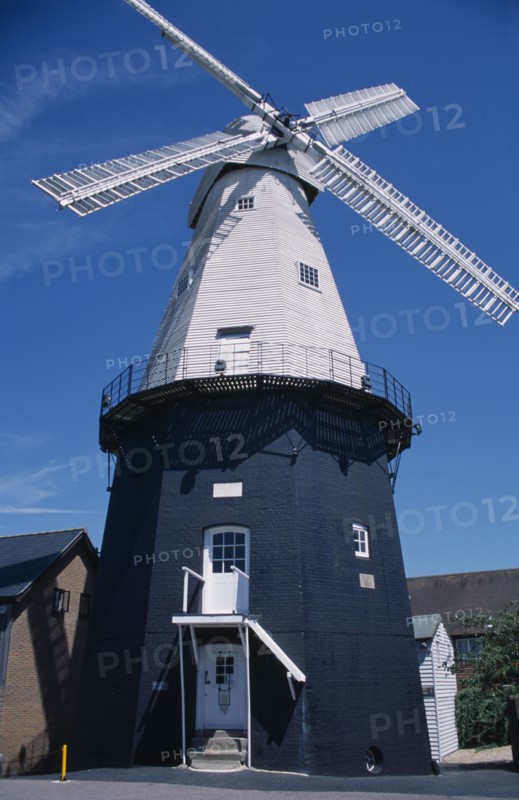 ENGLAND, Kent, Cranbrook, Union Watermill white weather boarded smock mill. It is the tallest mill in Kent at 70 ft