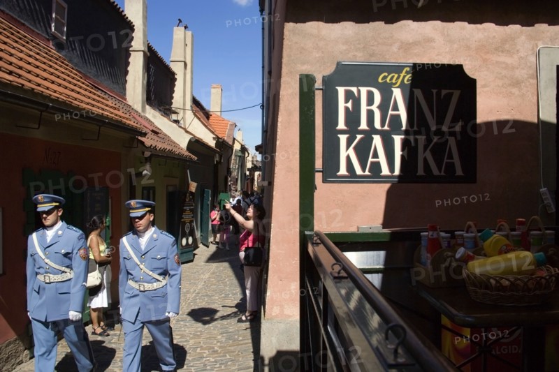 CZECH REPUBLIC, Bohemia, Prague, Golden Lane within Prague Castle in Hradcany with castle guards walking past Franz Kafka Cafe