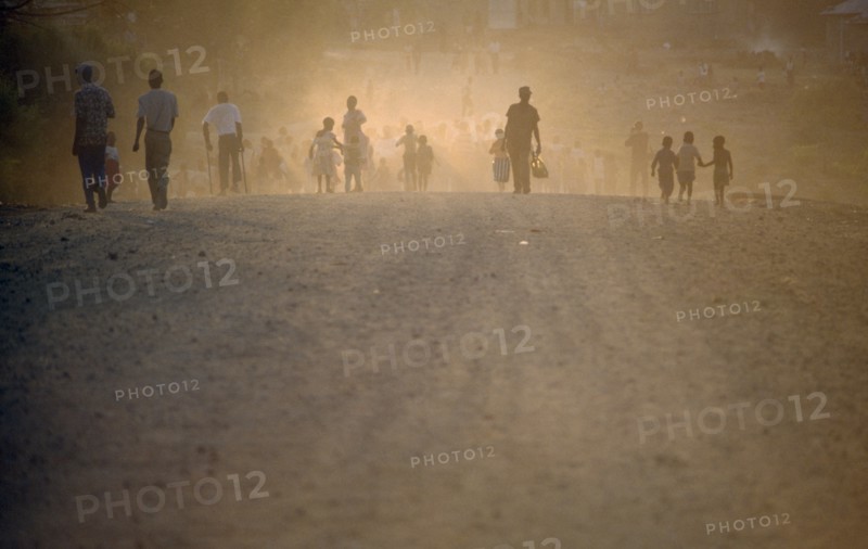 SOUTH AFRICA, Mpumalanga, Matsulu, "Protest march, people seen through dust and haze."