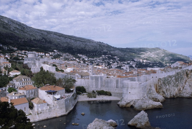 CROATIA, Dalmatia, Dubrovnik, View over the old city rooftops with the enclosed fortified walls
