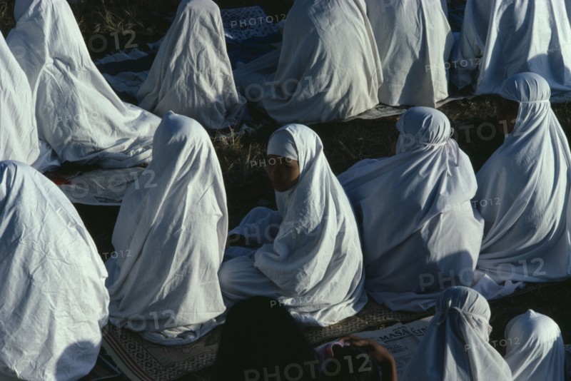 INDONESIA, Java, Yogyakarta, Young women attending dawn prayers to celebrate the end of Ramadan.