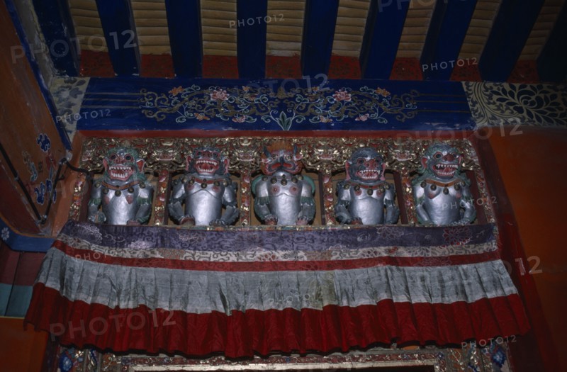 TIBET, Lahasa, The Potala Palace. Chief residence of the Dalai Lama. Detail of interior decoration with statues