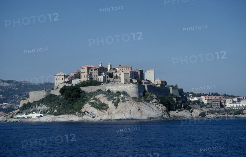 FRANCE, Corsica, Calvi, View across sea towards the fortified Citadel