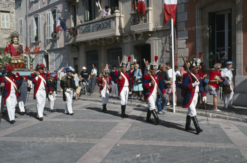 FRANCE, Provence Cote D Azur, Var, Saint Tropez. Bravade Festival with men in costume marching in a procession