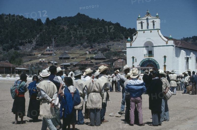 MEXICO, Chiapas, San Juan Chamula, Crowd gathered in square outside church in village where both Catholic and indigenous Mayan beliefs and traditions are followed.