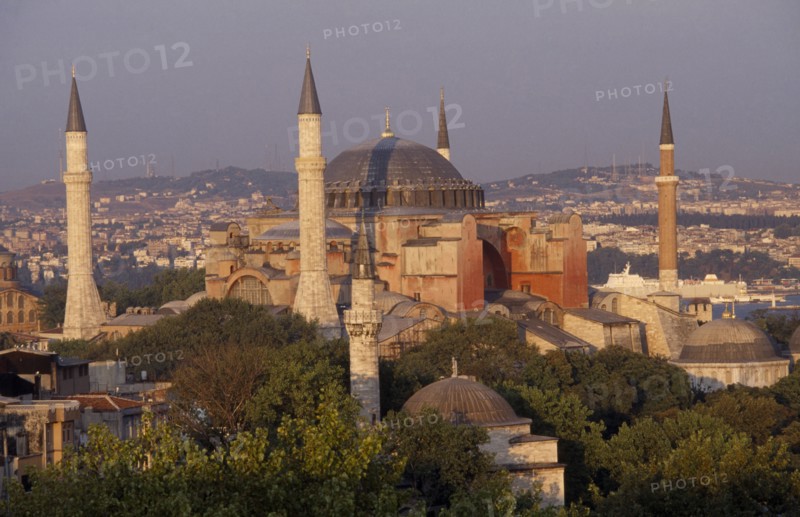 TURKEY, Istanbul, Dome and minarets of Haghia Sophia amongst rooftops of the Sultanahmet.  Former mosque now museum.