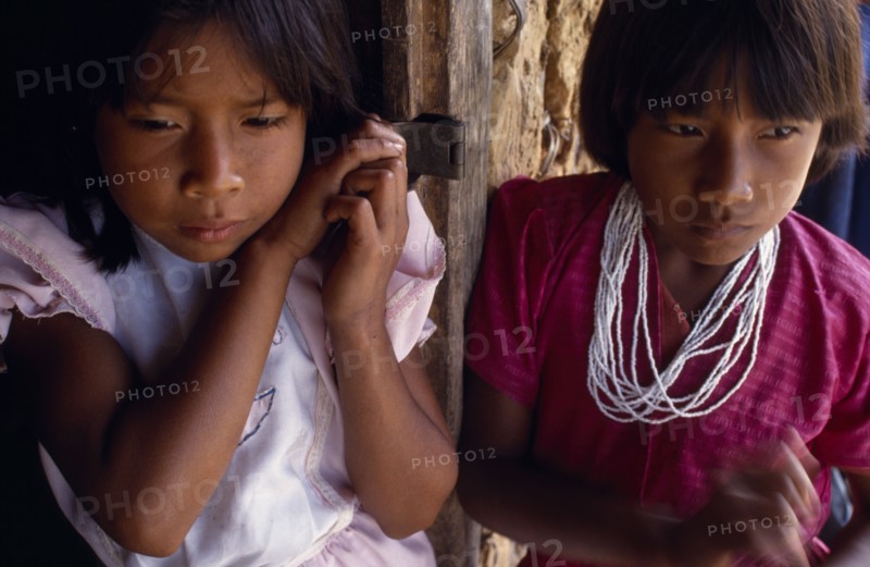 COLOMBIA, Amazonas, Santa Isabel, "Two young Macuna Indian girls, one wearing highly prized white beads as necklace."