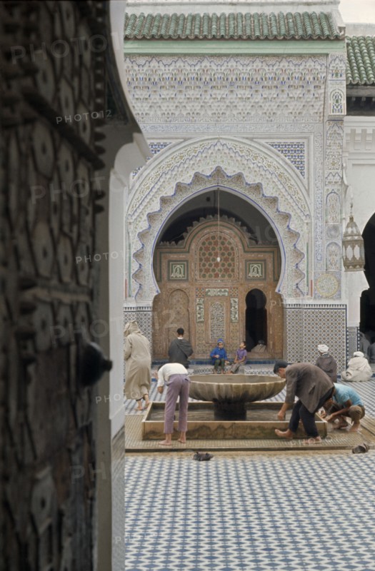 MOROCCO, Mosque, Men washing before entering mosque.