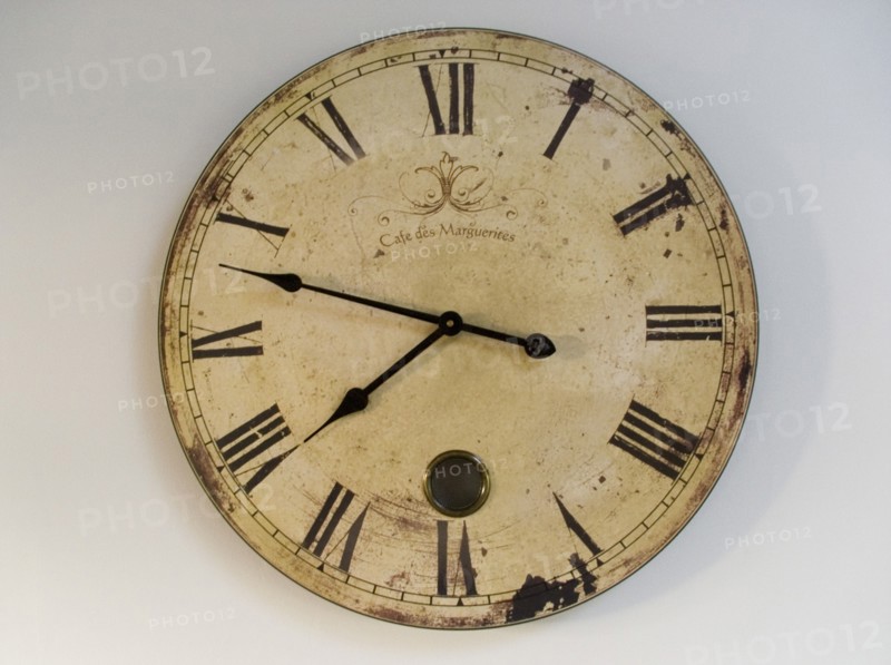 FRANCE, Deux Sevres Region, Poitiers, A classic clock face with Roman numerals against a plain background.