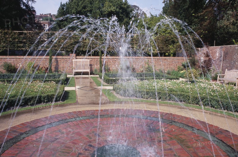 ENGLAND, East Sussex, Lewes, Southover Grange Gardens. Walled garden with central water fountain