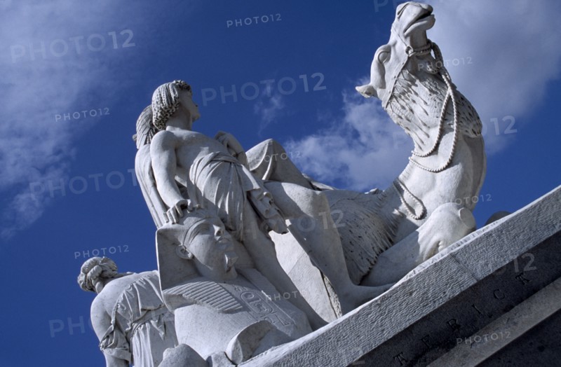 ENGLAND, London, Kensington Gardens. One of the four statues surrounding the Royal Albert Memorial depicting the four continents. Section of marble statue representing Africa.