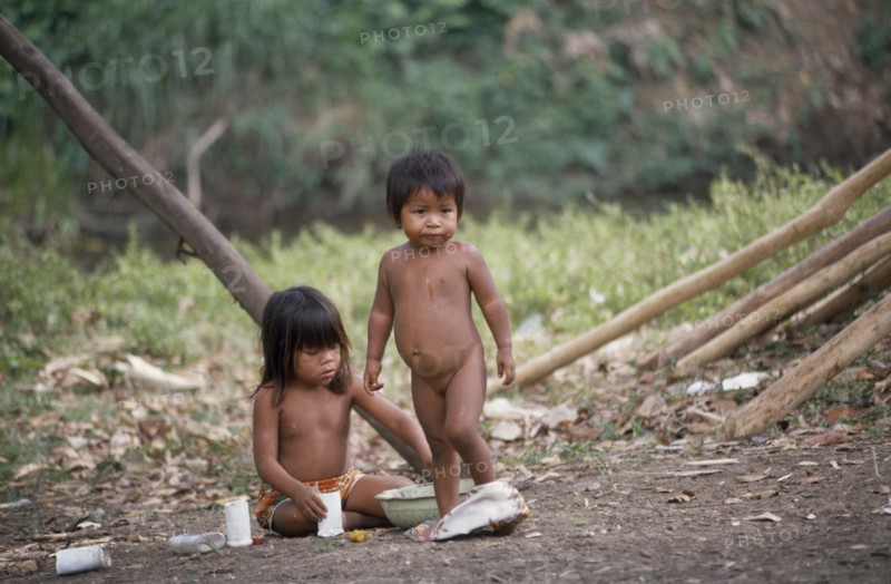PANAMA, Children, Two Embera Indian children playing with plastic cups and bowls