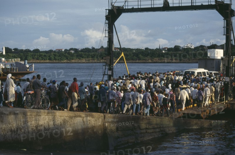 KENYA, Mombasa, Crowds boarding the Likoni ferry.