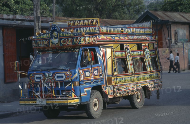 HAITI, Port au Prince, Brightly painted taptap bus.