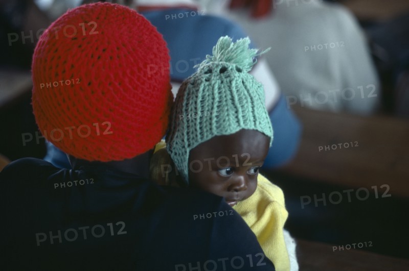 SOUTH AFRICA, Kwazulu Natal, Mother and baby attending Sunday church service.