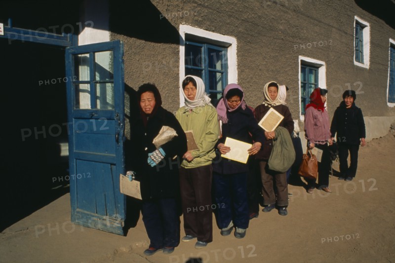 NORTH KOREA, North Hwanghhae Province, UNPA County, People affected by floods waiting in line at food distribution centre to be given WFP rice.