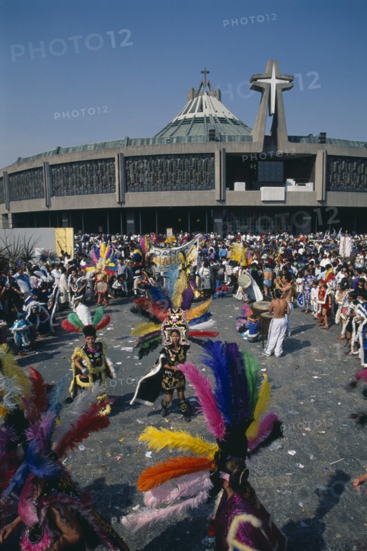 MEXICO, Mexico City, Our Lady of Guadaloupe Festival dancers celebrating outside the Basilica of Guadaloupe