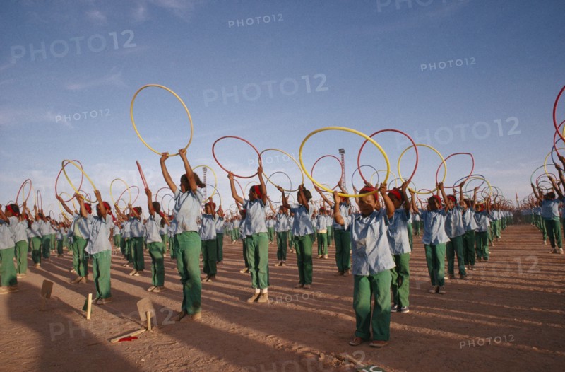 WESTERN SAHARA, SADR, "Parade of children with coloured hoops celebrating anniversary of the Polisario Front, the Sahrawi movement working towards independence."