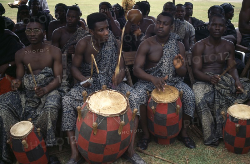 GHANA, Kumasi, Drummers playing at funeral of wife of a chief.
