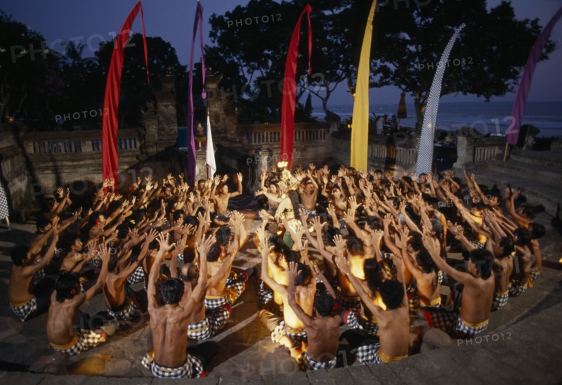 INDONESIA, Bali, Kechak dancers forming human mandala. The Kechak dance tells the story of Prince Rama and his quest to rescue his wife Sita from the demon king Ravana