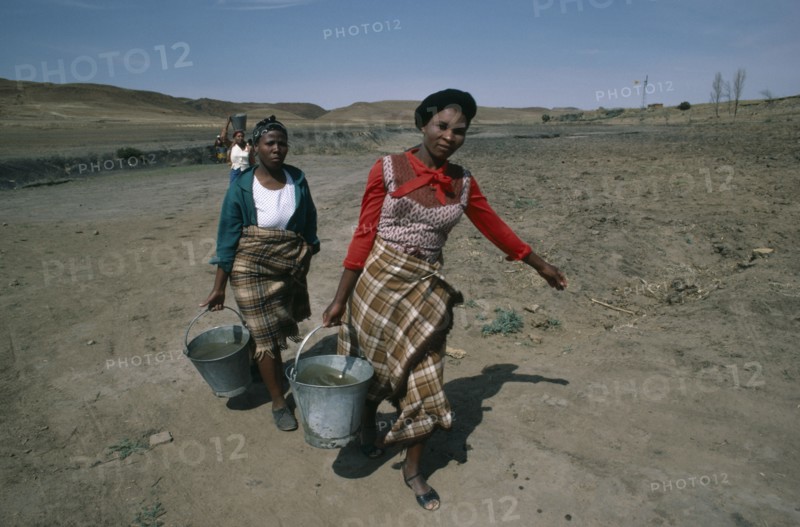 LESOTHO, Water, Women carrying buckets of water