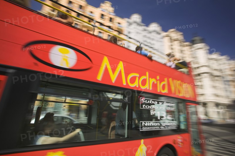 SPAIN, Madrid, Red sight seeing bus on the Gran Via.