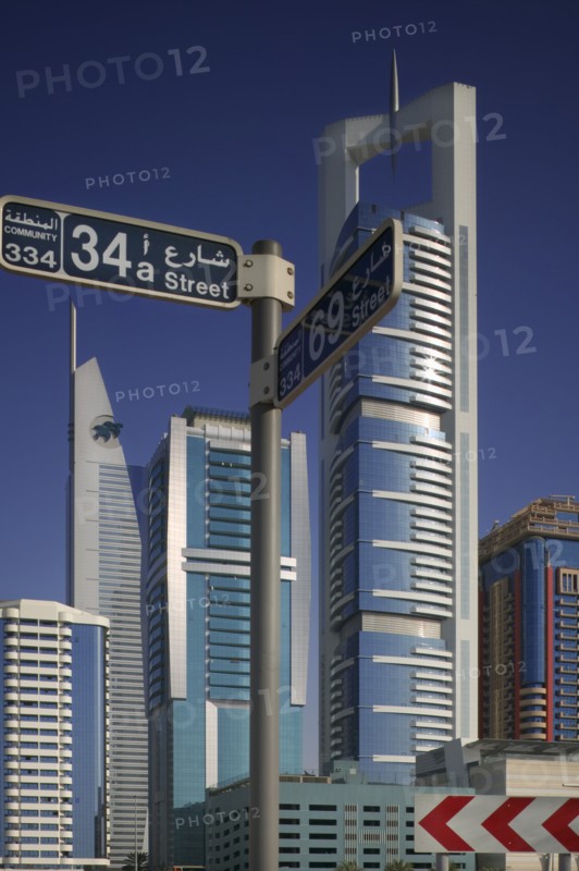 UAE, Dubai , "Modern architecture along Sheikh Zayed Road, with road sign."