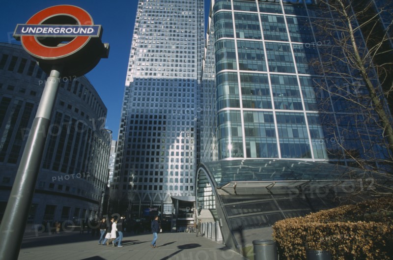 ENGLAND, London, Canary Wharf. View of the tower at 1 Canada Square with Underground in the foreground.